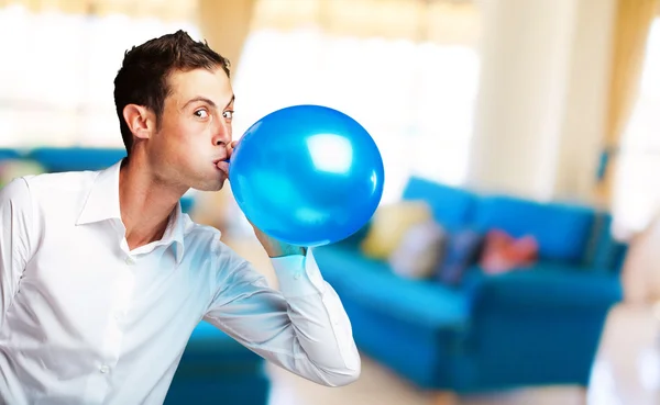 Portrait Of Young Man Blowing Balloon — Stok fotoğraf